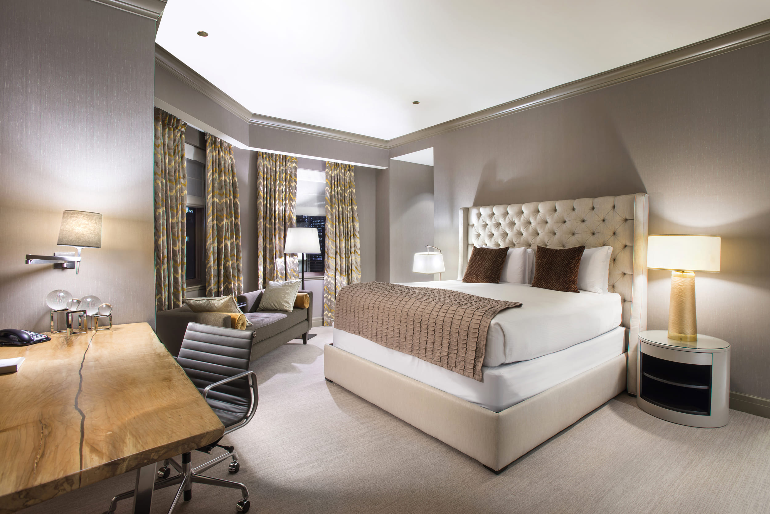 bedroom with desk and seating area