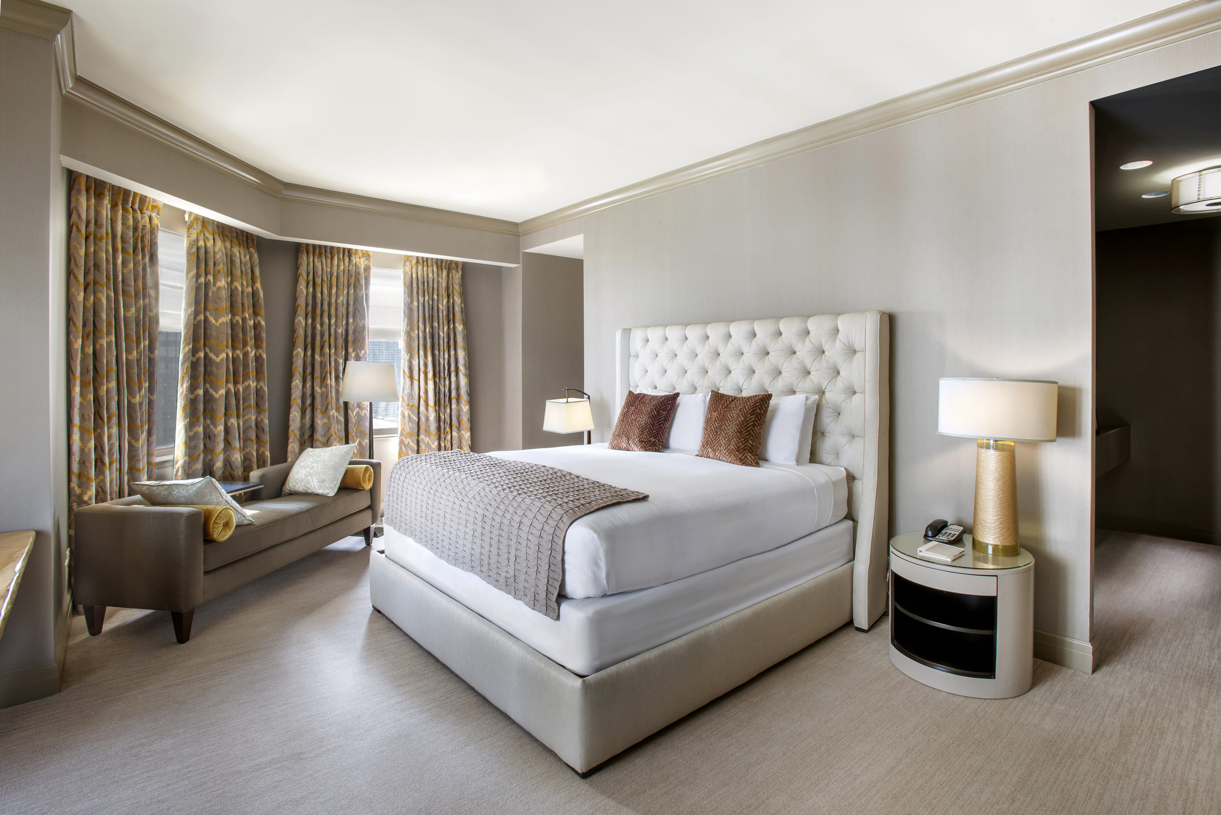 bedroom with desk and seating area