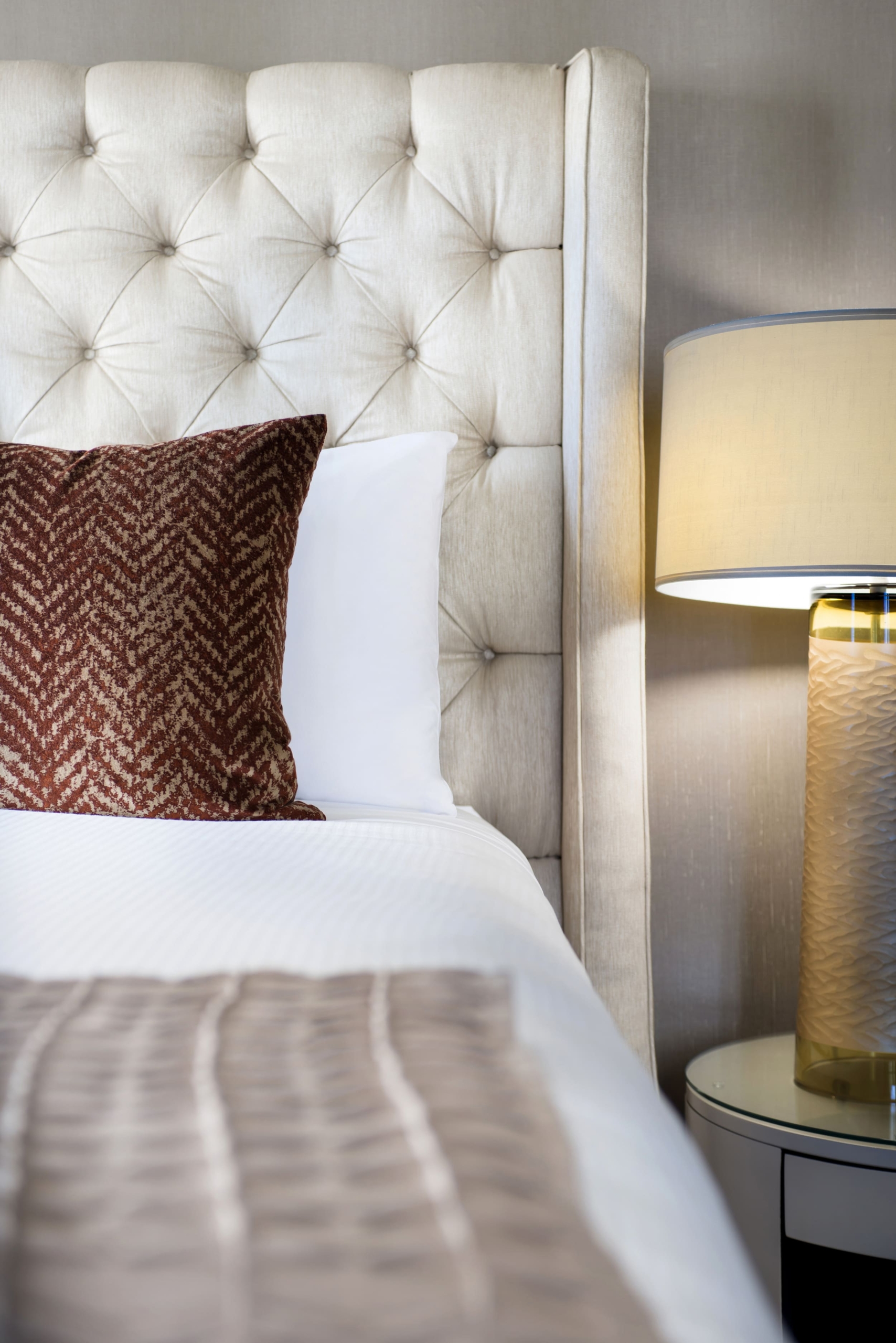 close up of bed and nightside table