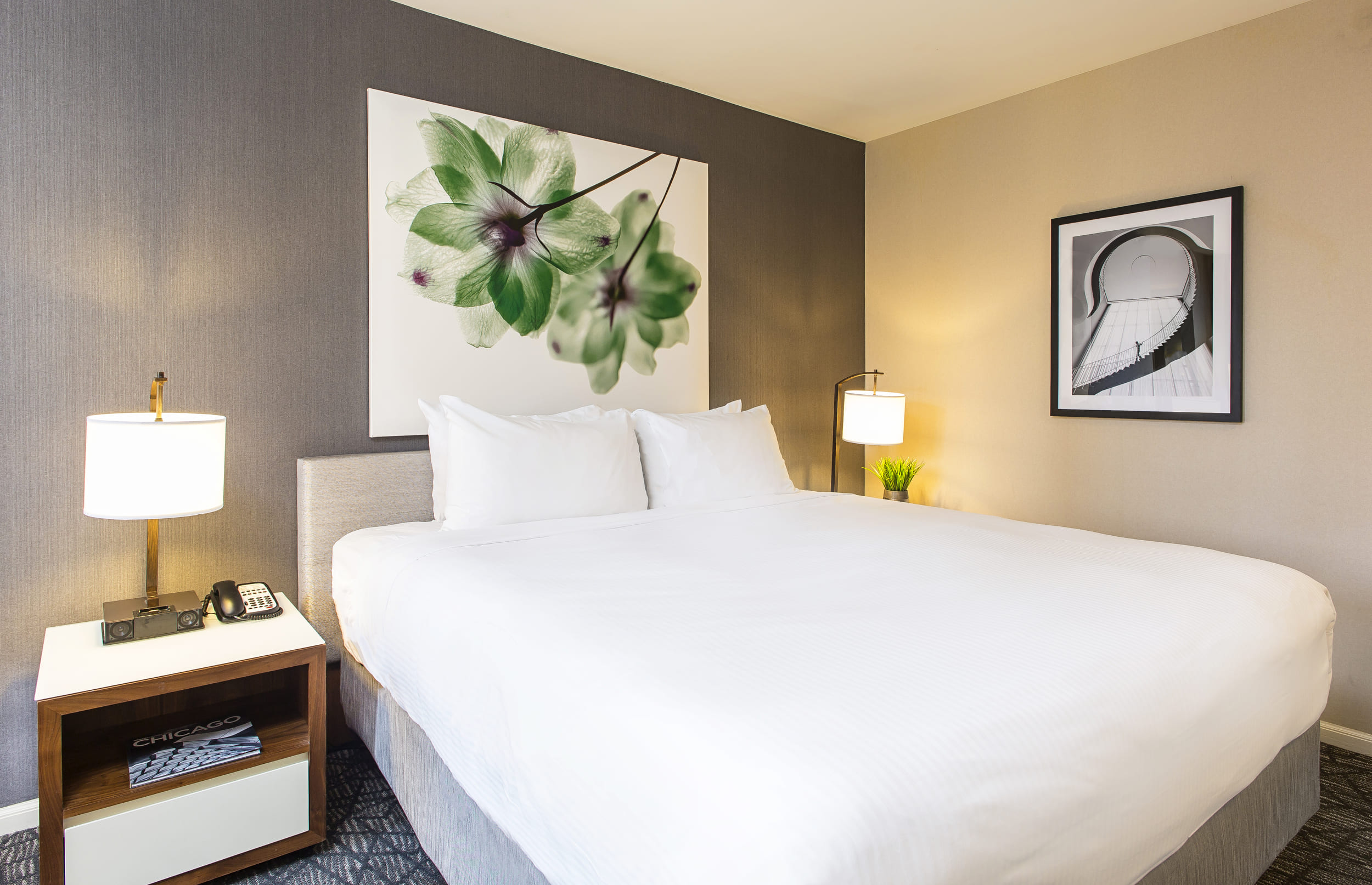 Bedroom with king bed and wall art