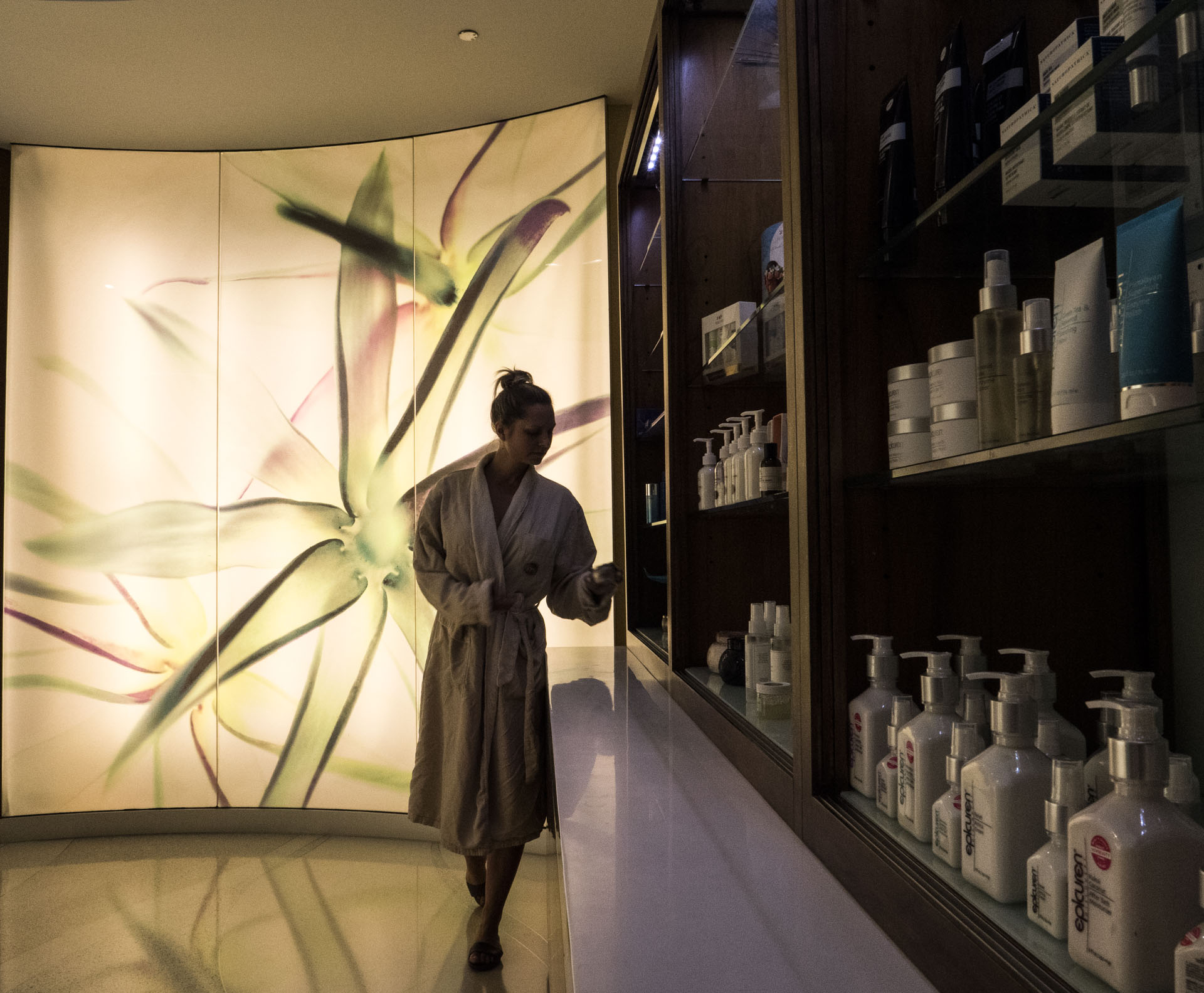 woman looking at spa products