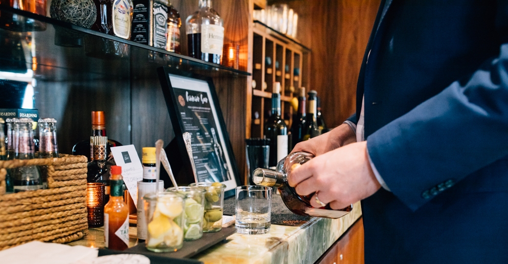 man mixing drinks