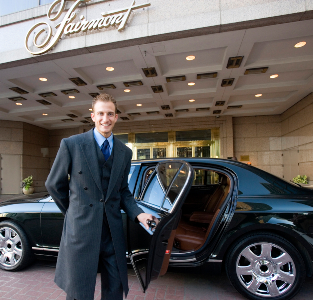 man holding car door open