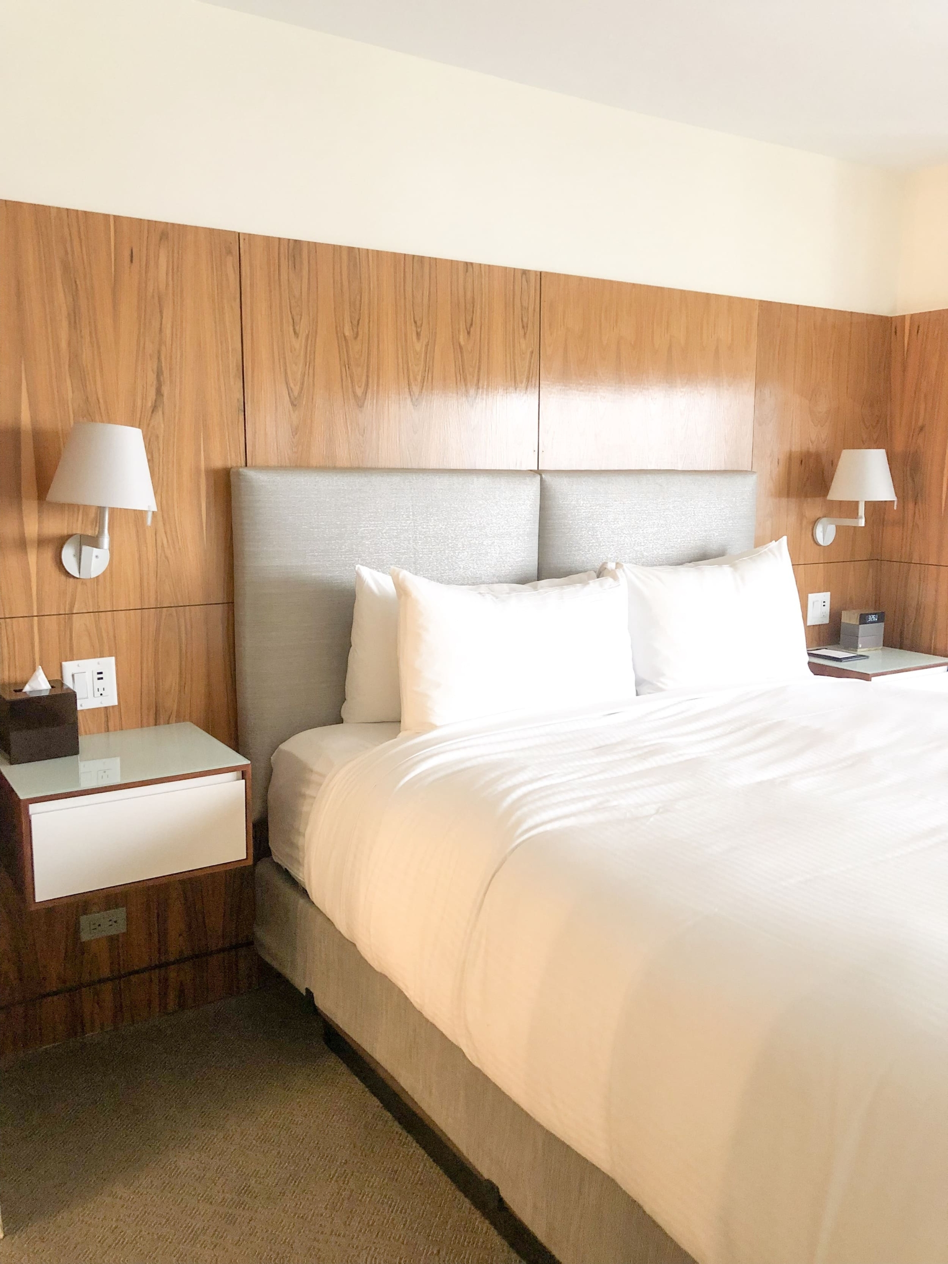 bedroom with two hovering nightside tables