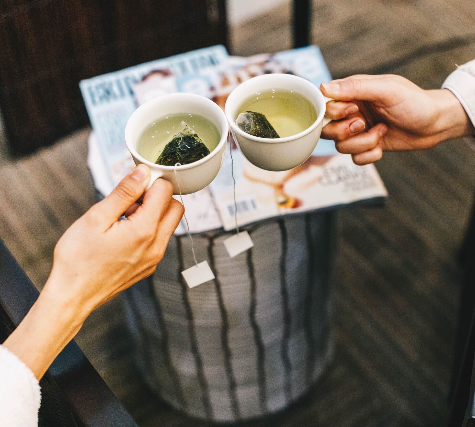 two people drinking tea